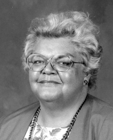 Black and white photograph of Janet Gardiner smiling in 1991