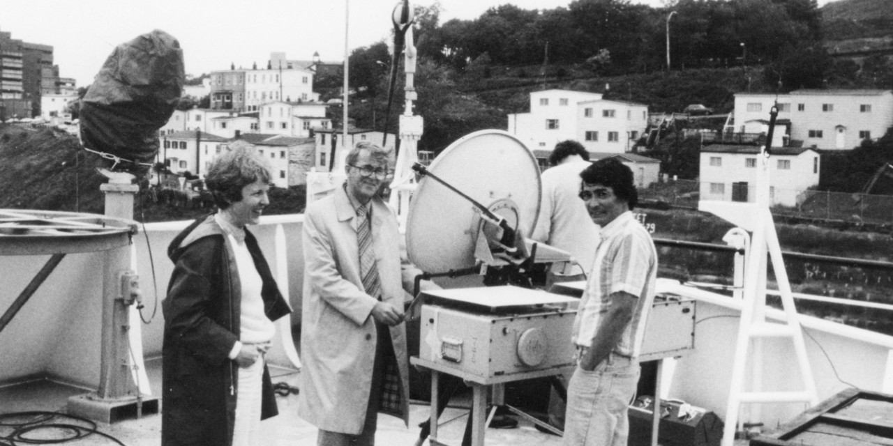 Dr. Arthur Maxwell House and three associates with the Anik B terminal and satellite dish in St. John’s in 1980