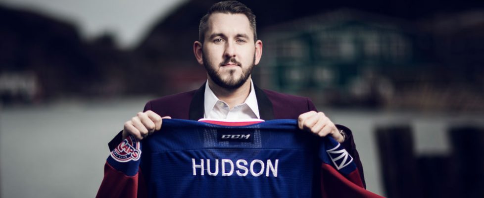 Greg O'Brien holding IceCaps Royal Newfoundland Regiment jersey