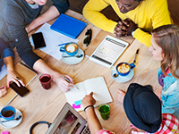 Top down view of students studying at a desk