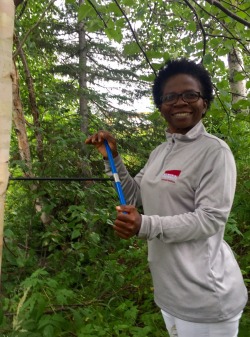 Dr. Merline Fonkwe samples a tree core. 

Photo by: Monica and Margaret Beyere