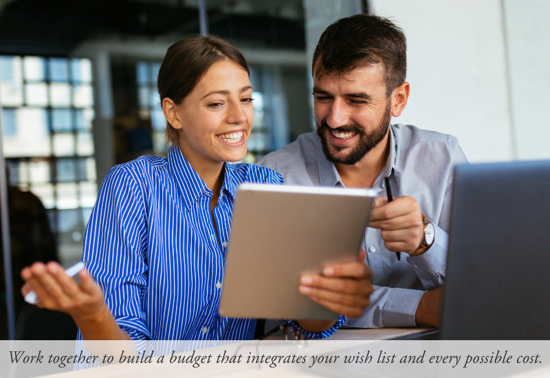 Image of two people looking at a budget