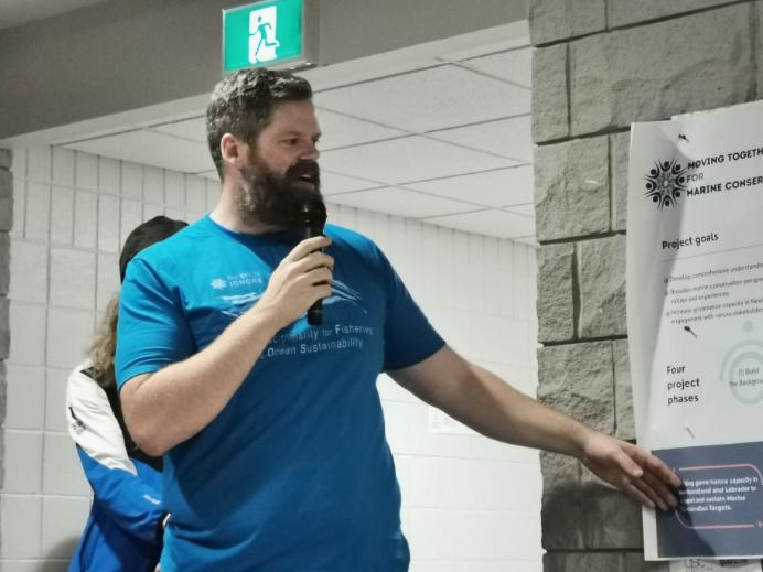 A man presents at a community event