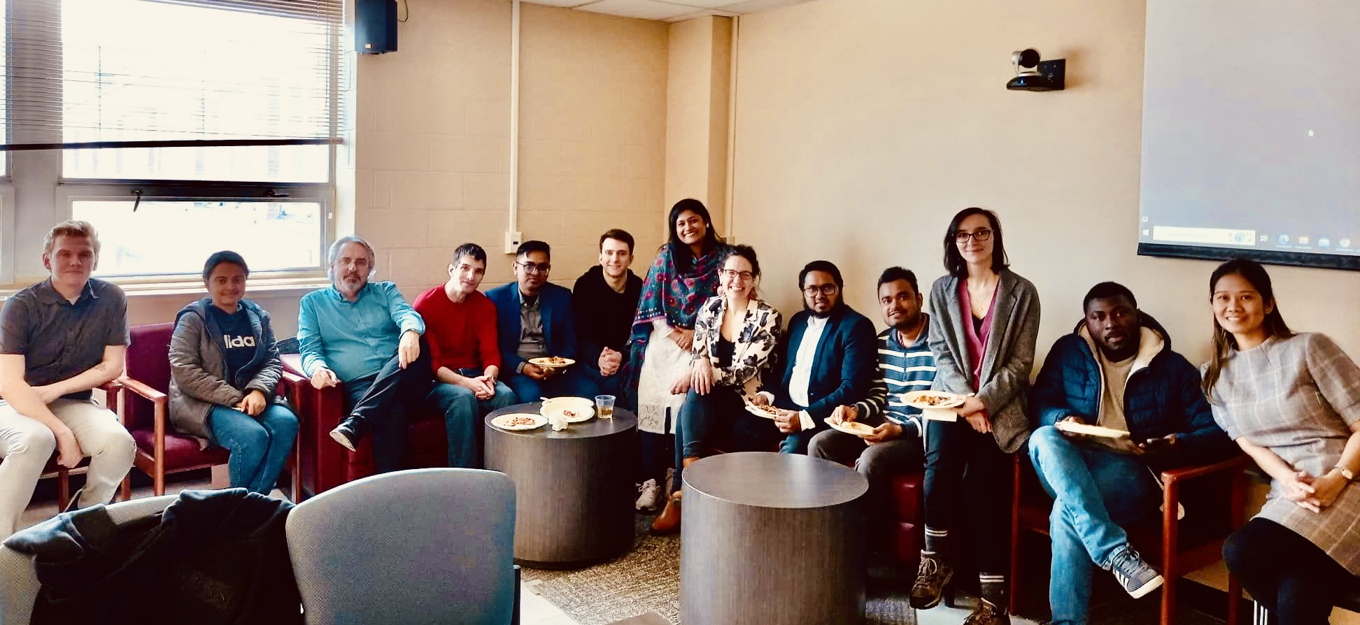 A group of political science graduate students smiling